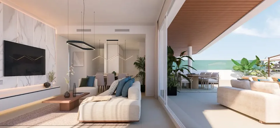 Salón de un apartamento con terraza abierta y vistas al mar